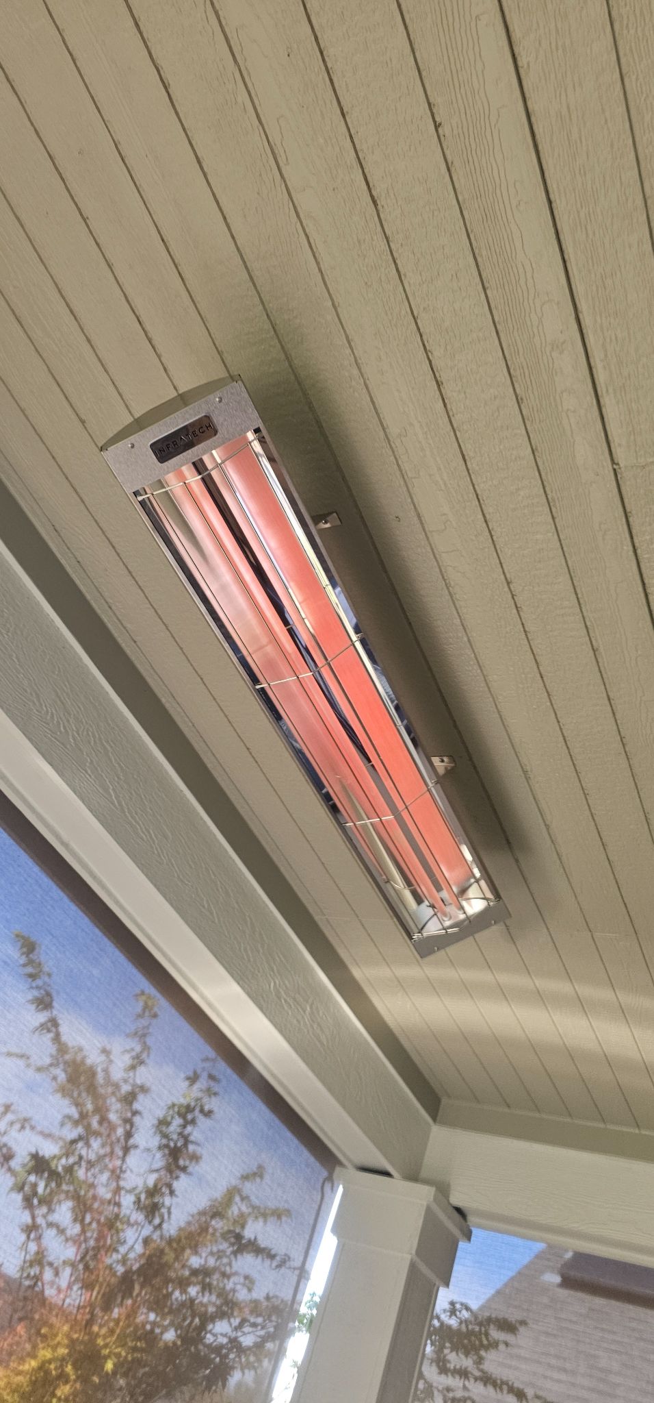 Outdoor infrared patio heater wired and mounted under a covered patio in Vancouver, WA by Brightwise Electric