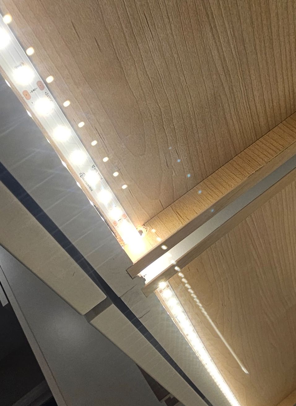 Under-shelf LED strip lighting wired and lit in a Vancouver, WA kitchen by Brightwise Electric