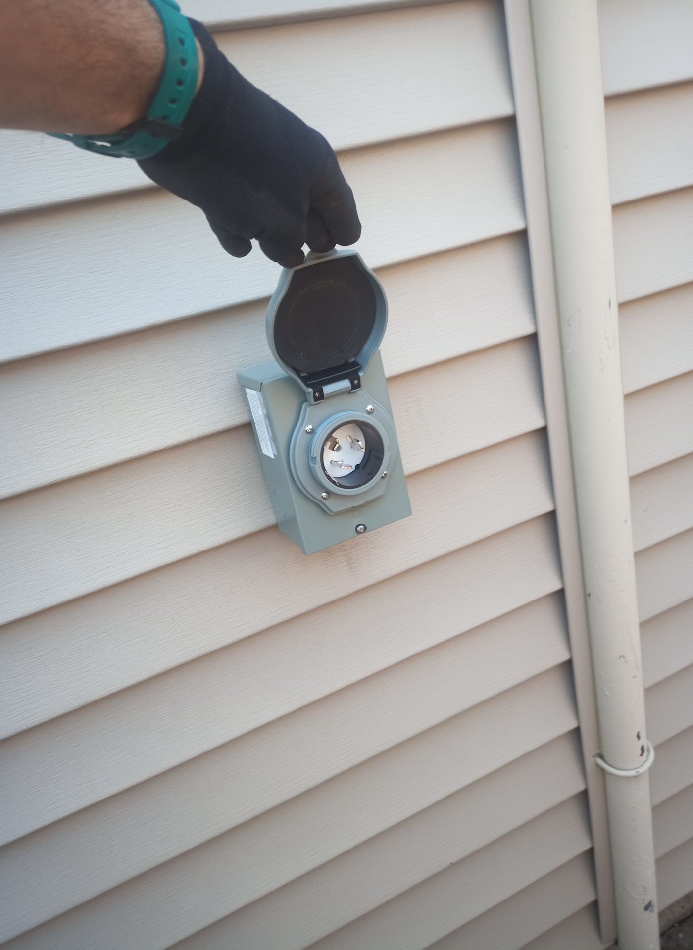 Weatherproof generator power inlet box installed on a Vancouver, WA home by Brightwise Electric