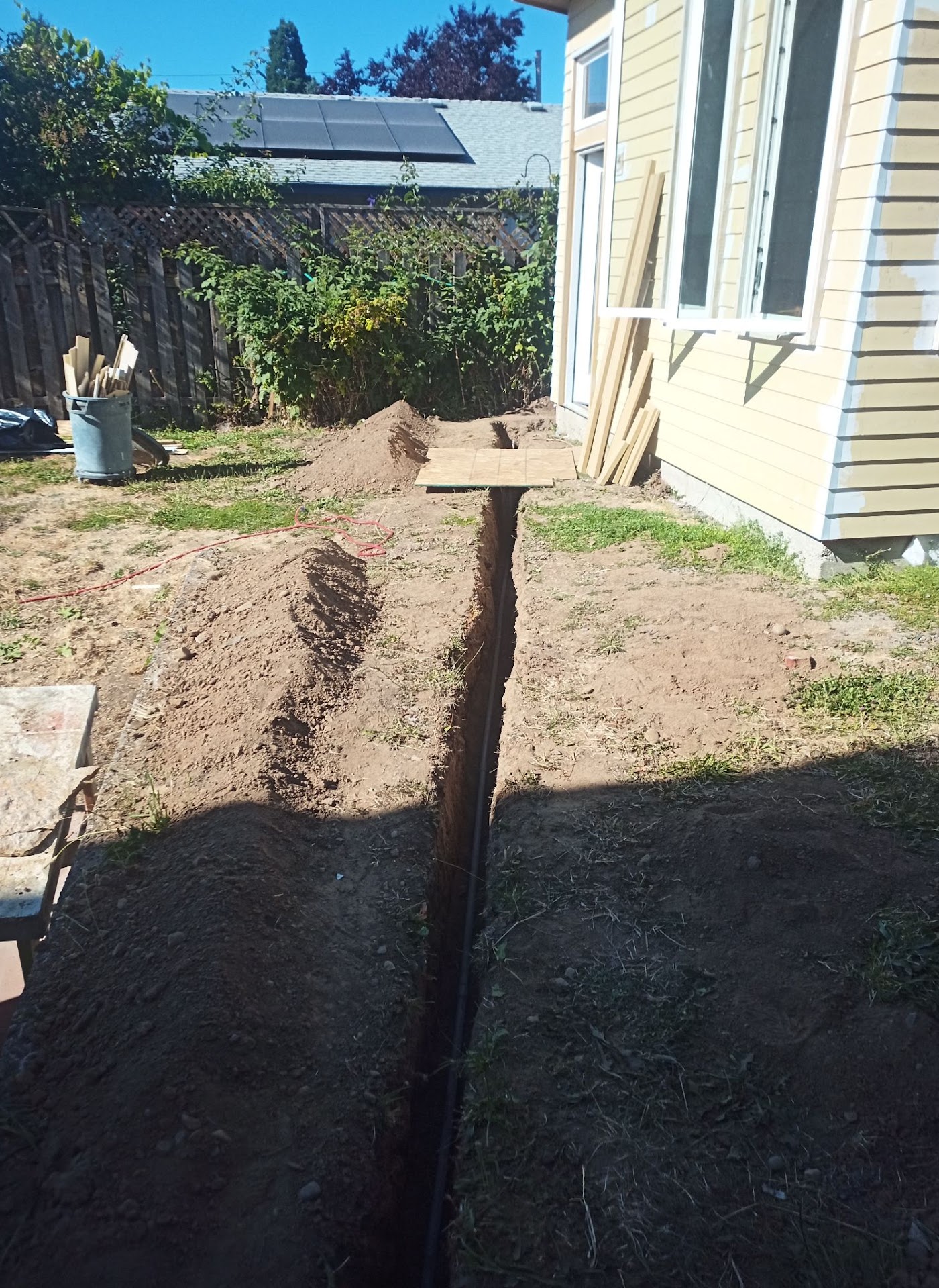 Trench dug for an underground conduit run to a detached structure in Vancouver, WA
