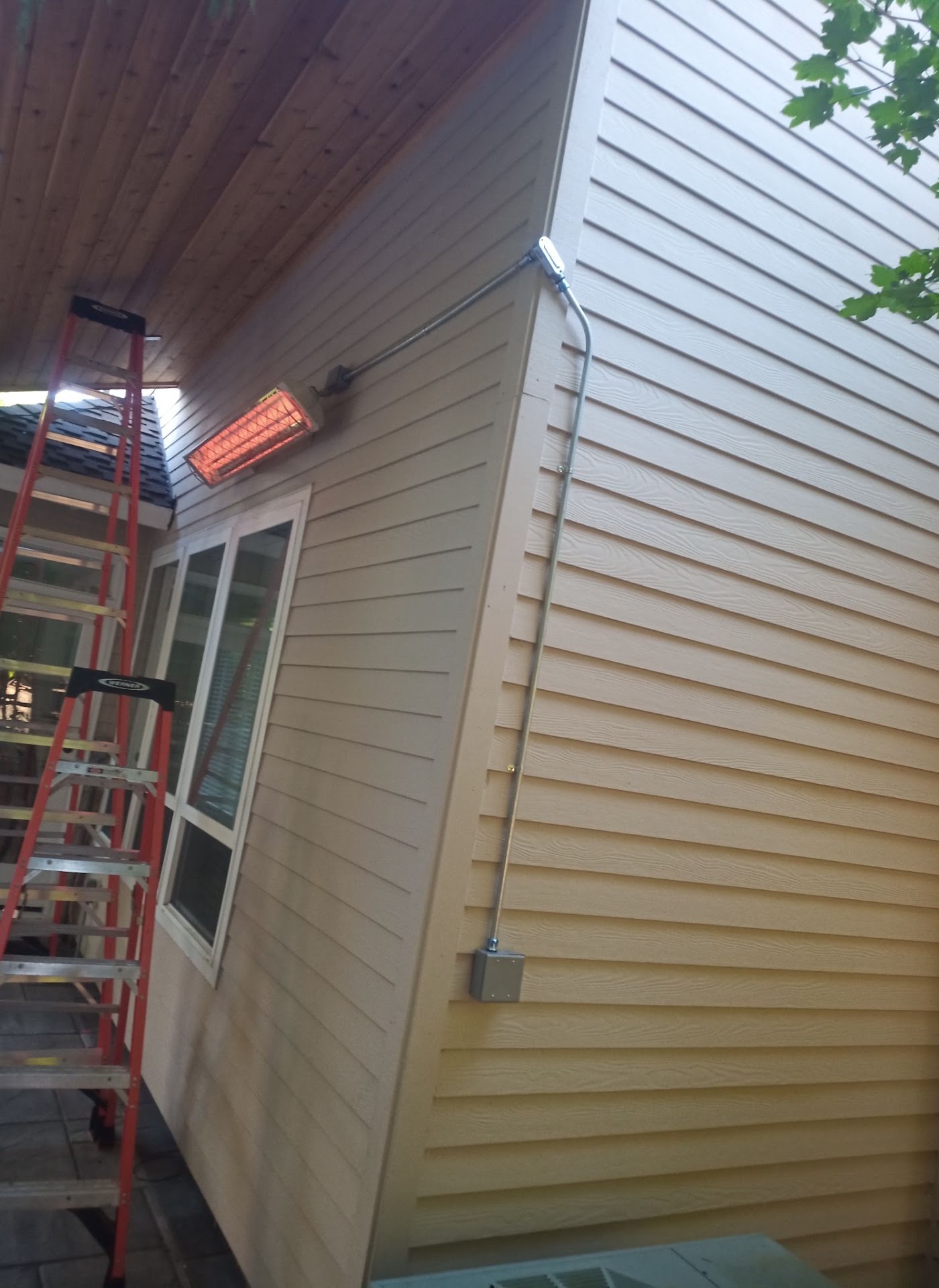 Outdoor infrared patio heater wired on a conduit run at a Vancouver, WA home