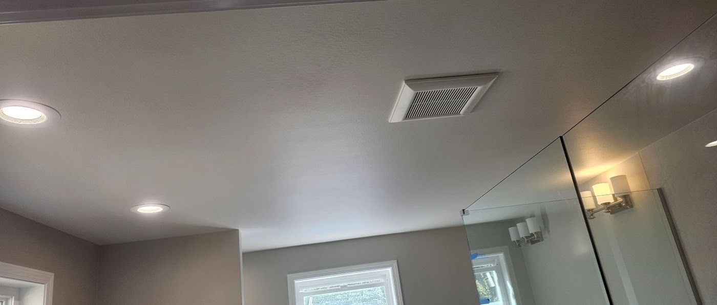 Finished bathroom with exhaust fan, recessed cans and vanity lighting in Vancouver, WA