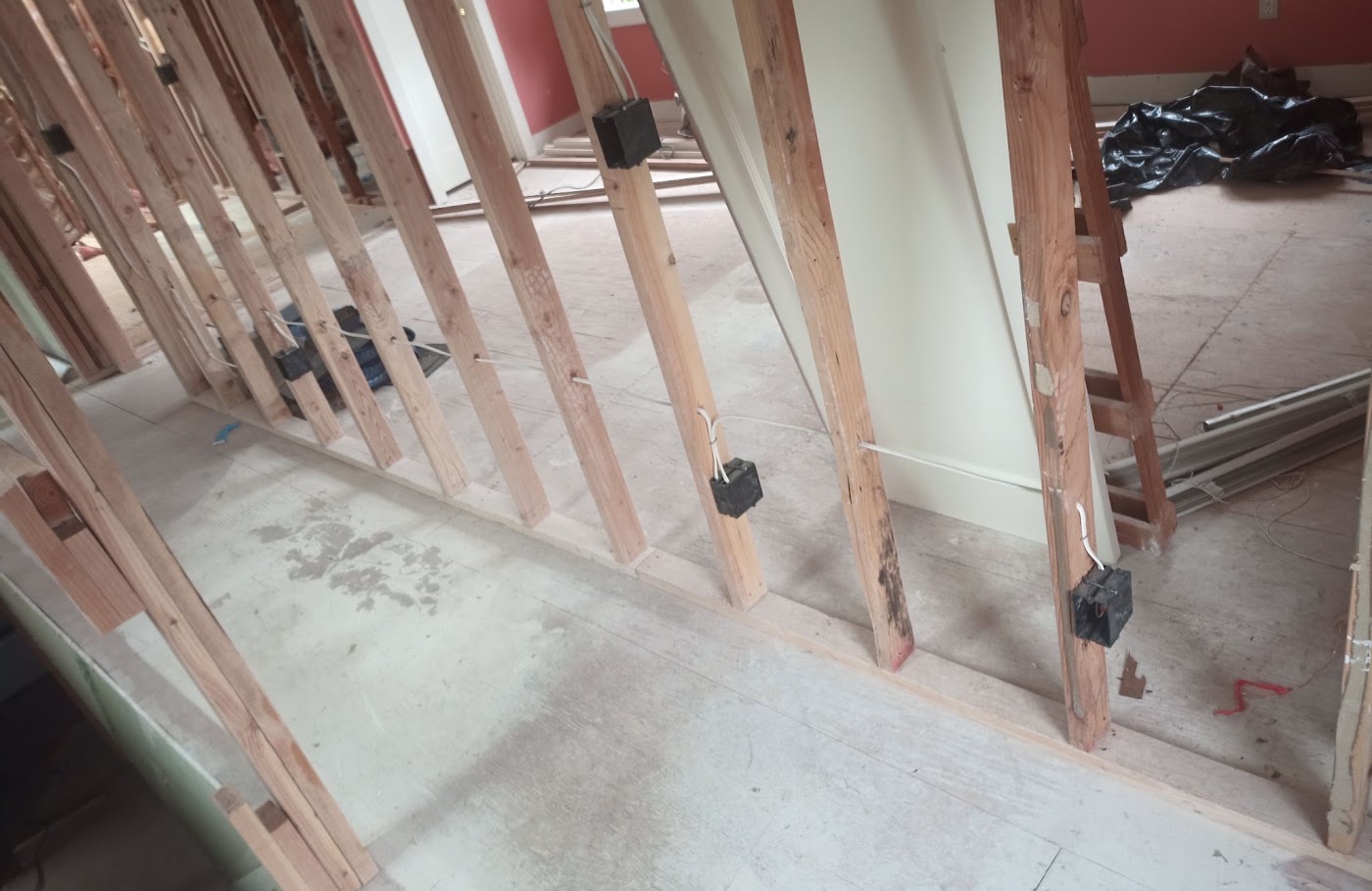 Switch and outlet boxes mounted on open studs during a Vancouver, WA home rewire