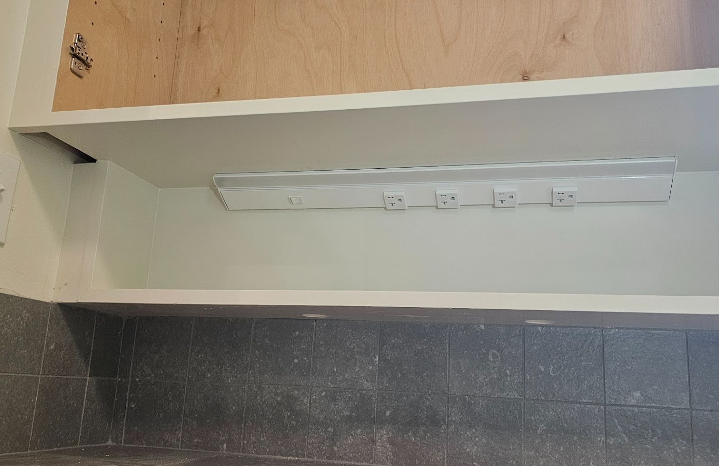 Under-cabinet light bar and a row of new receptacles above a tile backsplash in Vancouver, WA